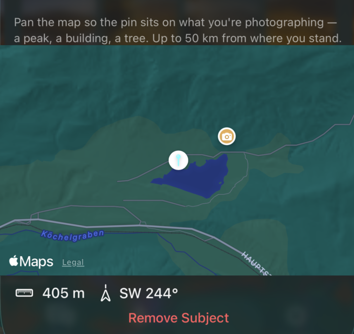 Screenshot of Inverza's Set Subject picker: a small map with an orange camera marker at the photographer's location and a blue pin on a cluster of buildings 405 m southwest, bearing 244°. Caption at the top instructs the user to pan the map so the pin sits on what they're photographing (a peak, a building, or a tree) up to 50 km from where they stand. A red 'Remove Subject' button is visible at the bottom.